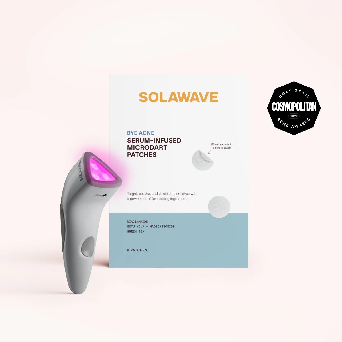 A compact device with a glowing tip beside the Bye Acne Pro Kit by SolaWave (charcoal) is perfect for light therapy. The Cosmopolitan 2023 award emblem stands out on the package containing 9 serum-infused microdart patches, ideal for blemish control.