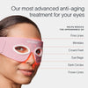 A person uses the Eye Recovery Pro Kit by SolaWave, a pink LED mask with white eye cutouts featuring LightBoost technology. This anti-aging product targets fine lines, wrinkles, crows feet, and dark circles with advanced light therapy for more youthful eyes.