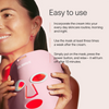 A person holds a Solawave Pink LED Light Therapy Mask, part of the Wrinkle Retreat Face Mask & LightBoost Cream Kit, aimed at enhancing skin radiance. They wear pink earrings and a partially visible face. The background includes instructions for easy use to tackle fine lines and wrinkles.