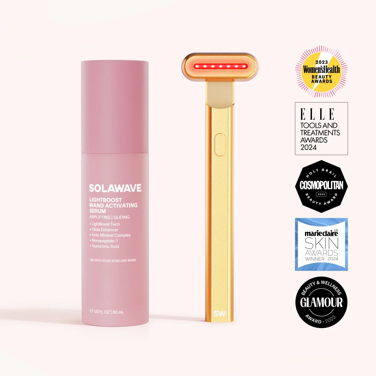 The gold Solawave 4-in-1 Red Light Therapy Wand & Activating Serum Kit features a pink serum and a device with a red light strip for skin-sculpting and collagen boosting. It is displayed against a light beige background, surrounded by Elle and Cosmopolitan award logos. || Gold