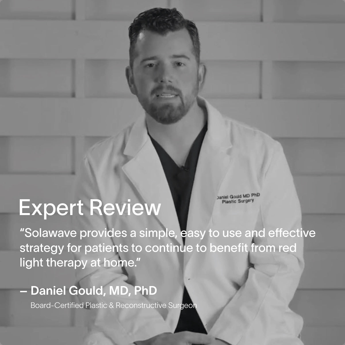 A man in a white lab coat sits before a geometric background, with text featuring a review of Solawaves 4-in-1 Red Light Therapy Wand & Activating Serum Kit and its benefits, attributed to Daniel Gould, MD, PhD, board-certified plastic and reconstructive surgeon.