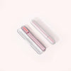 Three Solawave Radiant Renewal Skincare Wands, two white and one pink, feature a sleek cylindrical design with small lights. Positioned diagonally against a light background, they elegantly display the brand name. Ideal for home or travel use with a handy carrying case for convenience.